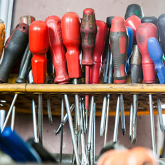 Assortment of tools. Screwdrivers in mechanic garage car service