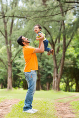 happy young father playing with son