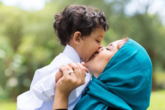 Muslim Mother Kissing Her Baby Boy