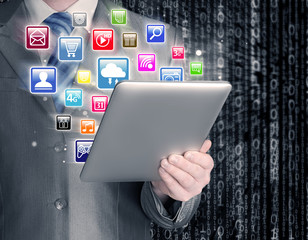 Business man use tablet pc with colorful application icons