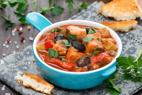 Fish stew with olives in tomato sauce, horizontal