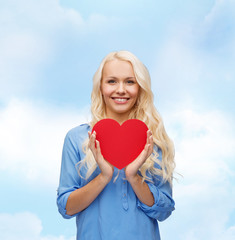 smiling woman with red heart