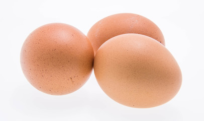 three eggs on white background