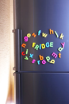 Word Fridge spelled out using colorful magnetic letters
