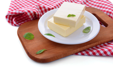 Tasty butter on plate, isolated on white