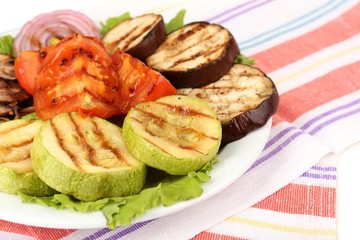 Delicious grilled vegetables on plate on table close-up