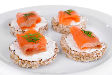 Delicious canapes on plate close-up