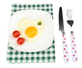 Scrambled eggs with bread on plate, on color napkin