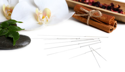 Composition with needles for acupuncture, isolated on white