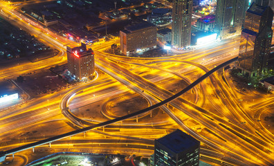 Aerial view of motorway in modern city at night