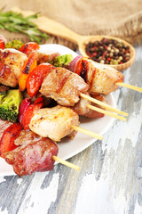 Pork kebab on wooden table close up