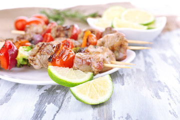 Pork kebab on wooden table close up