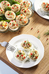 stuffed eggs with ham, red pepper and dill