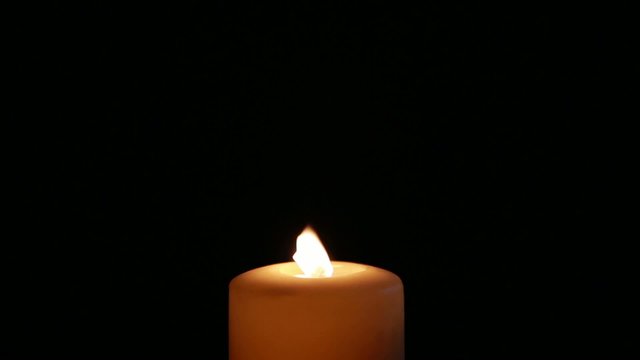 Candle goes on black background