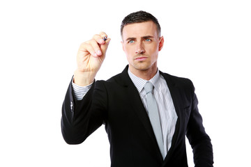 Handsome businessman writes with pen at copyspace