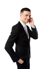 Portrait of a happy businessman with phone