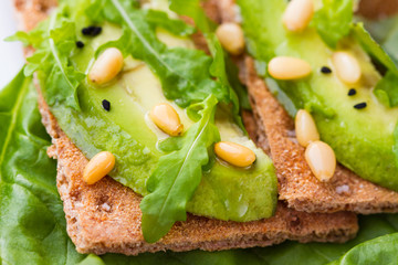 Crispbread with avocado and pine nuts