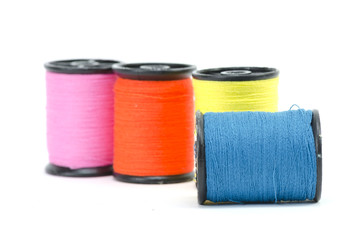 colorful sewing Threads isolated on white background
