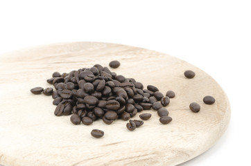 Coffee beans and kitchenware made ​​of wood isolated on white