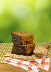 image of of bread and wheat on a green background
