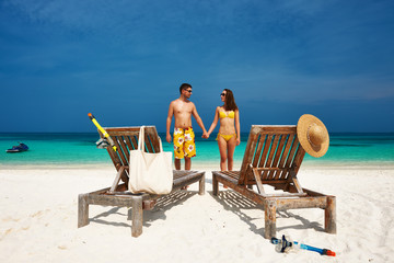 Couple in yellow on a beach at Maldives