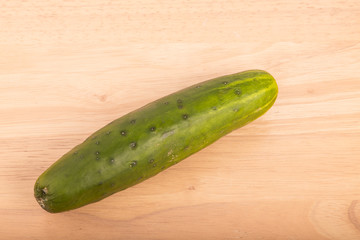 Whole Cucumber on Wood Table