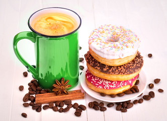 Tasty donut with a cup of coffee
