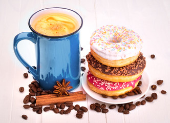 Tasty donut with a cup of coffee