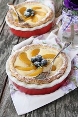 Homemade tart with creamcheese filling,peach and blueberries.