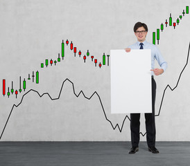 Businessman holding a placard. forex chart background.