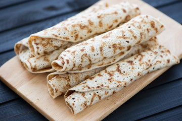 Rolled stuffed pancakes, horizontal shot