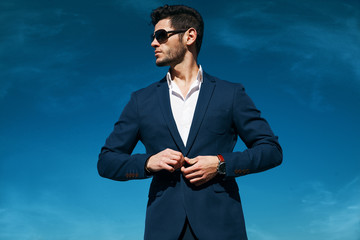  Outdoors fashion portrait. Man with glasses.