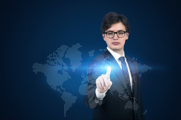 A businessman pointing out the hologram map