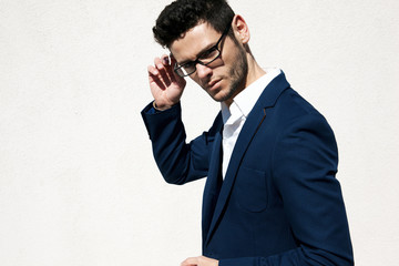 Young handsome man wearing fashion eyeglasses