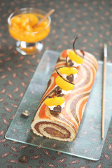Striped Roll Cake with chocolate filling and tangerines
