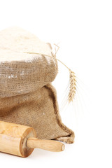 Sack and rolling pin.