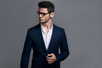 Portrait of handsome stylish man in elegant suit