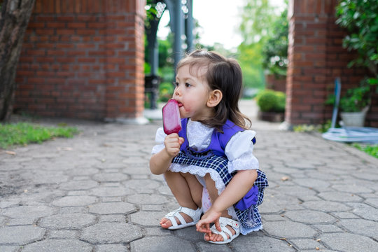 Girl Eating Purple Ice Cream