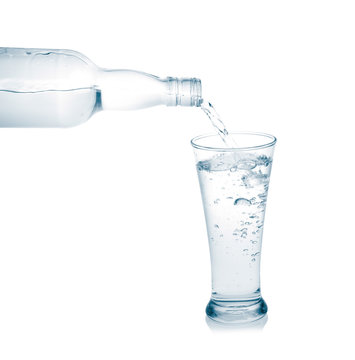 Pour into a glass isolated on a white background.