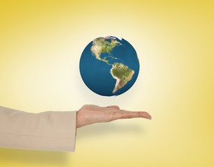 Composite image of female hand presenting earth