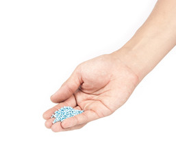 Fertilizer in hands isolated on white