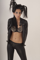 Naklejka premium Beautiful girl posing in a leather jacket