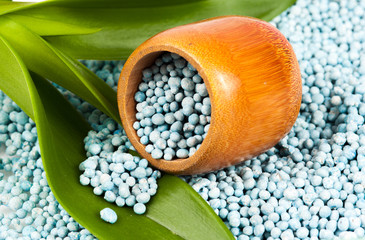 Blue fertilizer on white background