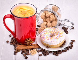 Tasty donut with a cup of coffee