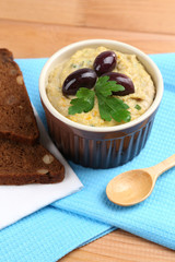 Bowl of tasty fresh hummus with tomatoes
