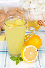 Healthy ginger tea with lemon and honey on table close-up