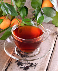 Tea and branch of tangerines