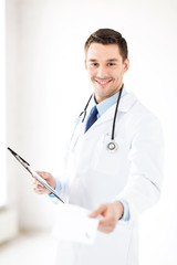 male doctor writing prescription