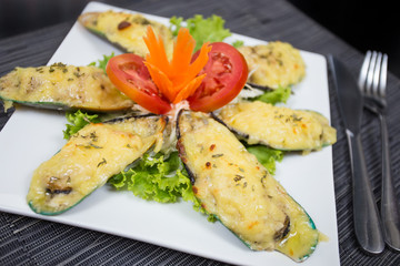 Steamed Mussels baked with cheese.