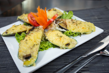 Steamed Mussels baked with cheese.